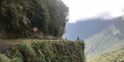 ADV rider on road with cliff in bolivia