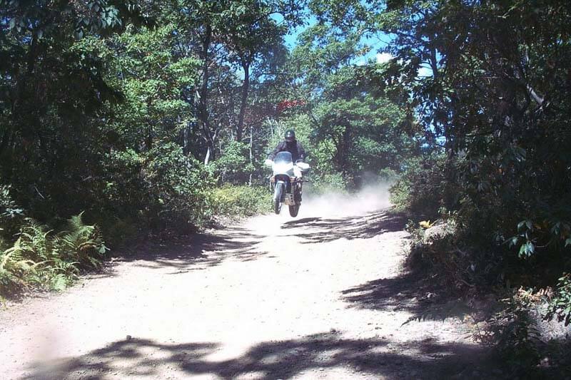 Honda Transalp offroad flying mid air.