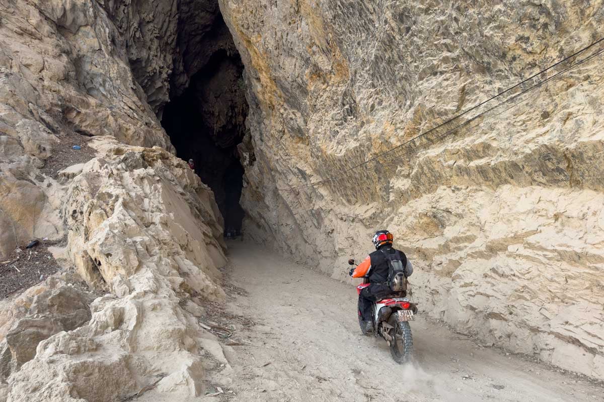 rider-entering-cave-vietnam