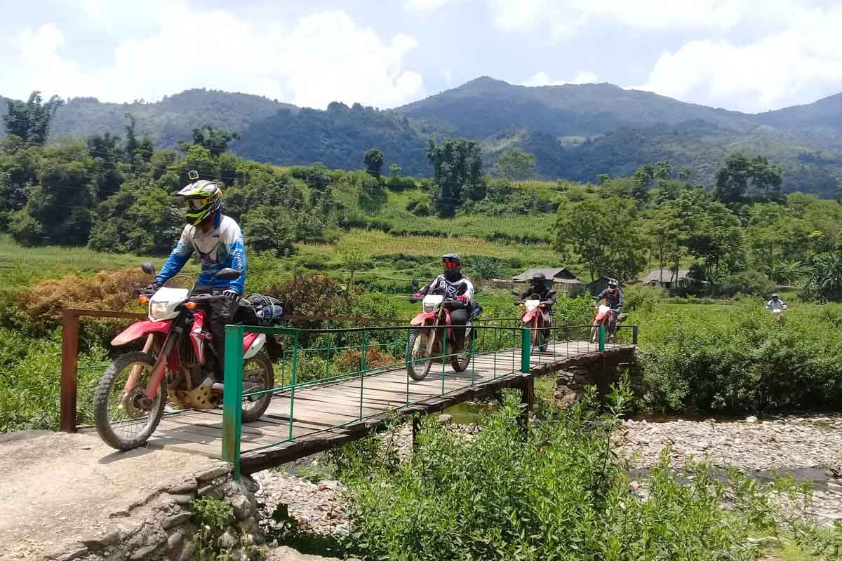 riders-crossing-a-bridge-in-vietnam