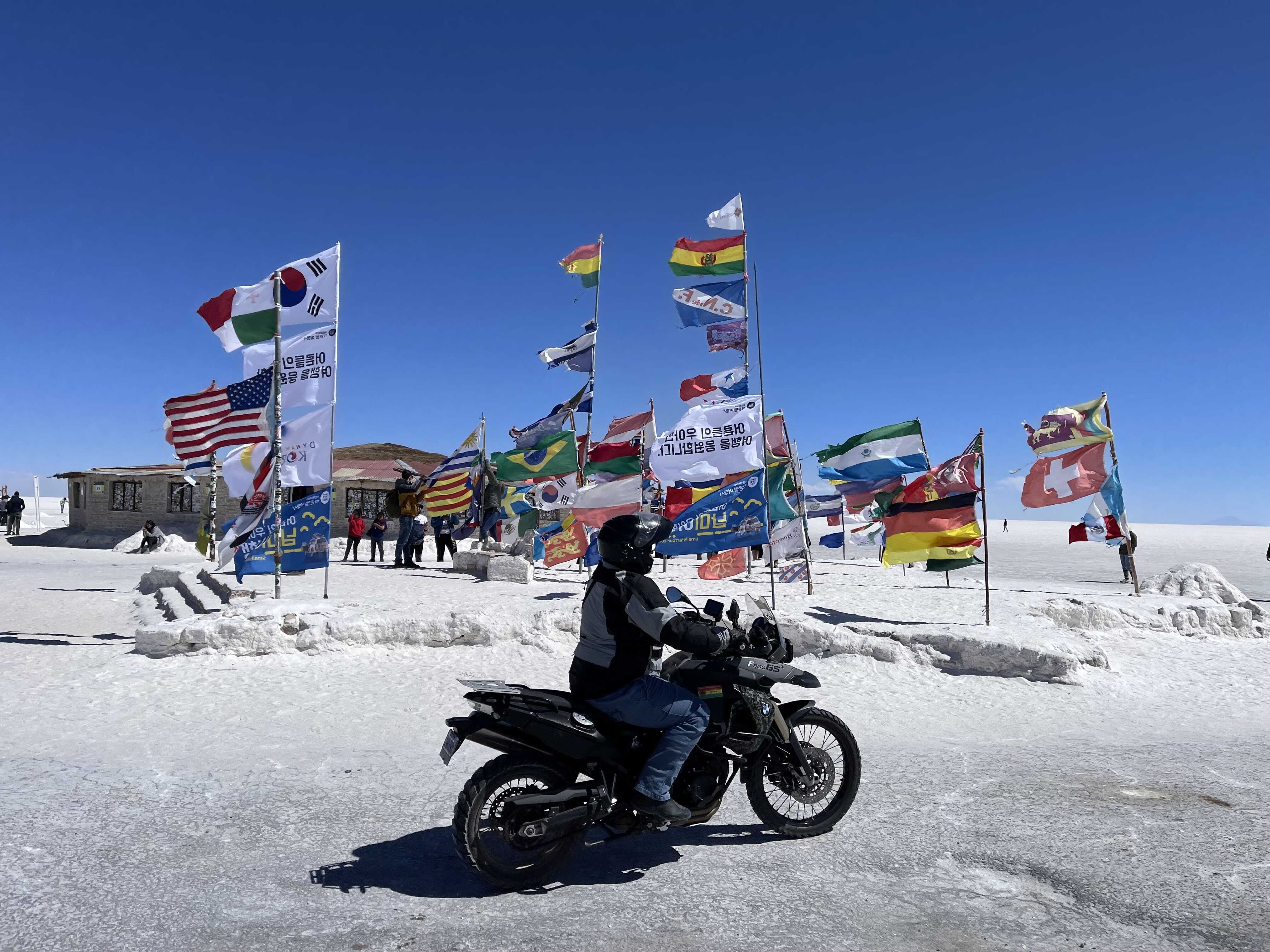 National Flags in Bolivia near salt desert