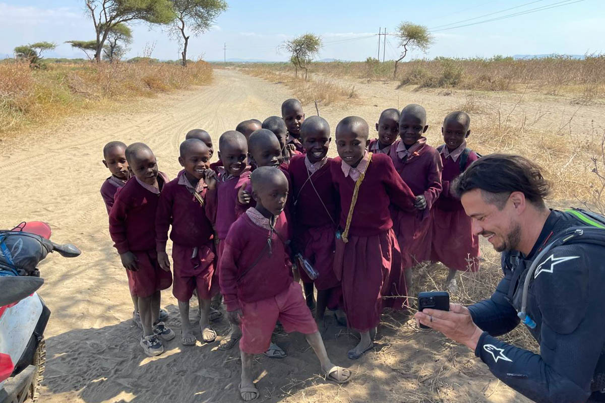 garrett-with-african-kids-showing-phone-tanzania